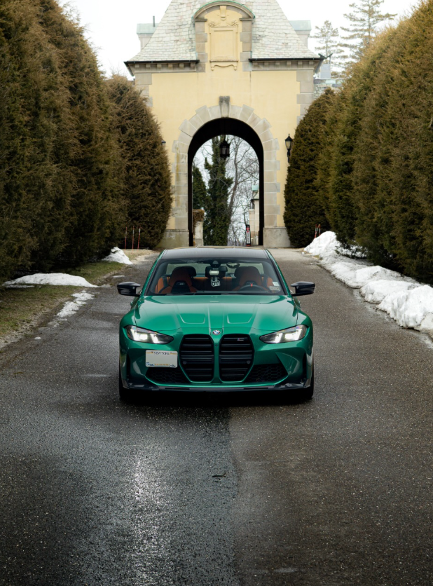 Green BMW M3 at archway